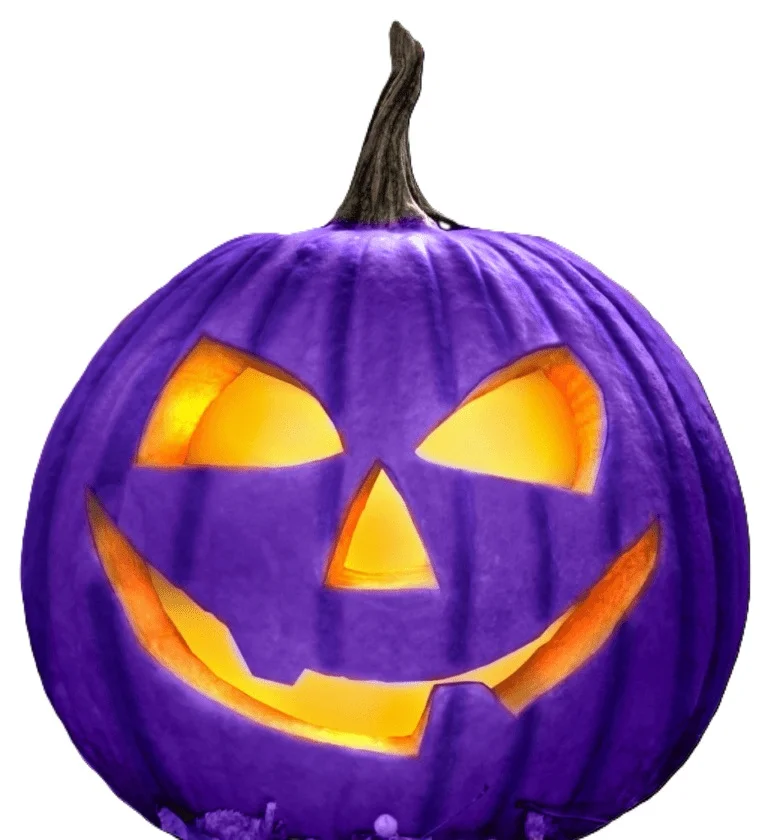 purple carved pumpkin with orange backlight