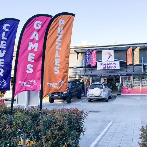Exterior of Indooroopilly Presents of Mind shop showing colourful banners and entry